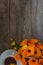 A Cup of tea with a bouquet of calendula on a wooden background with a copy of space