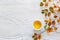 Cup  of tea and Branches with small colorful autumn leaves Spiraea Vanhouttei on  white wooden table. Flat lay