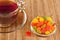 Cup of tea with candied fruits