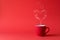 Cup of tea or coffee with steam in one heart shape on red background. Valentine`s day celebration or love concept. Copy space