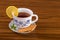 Cup of tea with cookies, lemon and mint