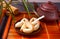 Cup of tea with fortune cookies, teapot in oriental style on a wooden tray