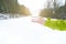 Cup of tea holding in woman hand. Winter background. Hot drink with foam. Snow and cold weather. Coffee break. Concept of drink in