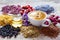 Cup of tea, honey jar, healing herbs and herbal tea assortment