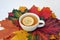 Cup of tea with lemon with autumn leaves