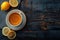 A cup of tea with lemon high angle view on a dark wooden background space for text