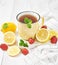 Cup tea with lemon and strawberries. Cozy morning. Healthy breakfast. Good morning. Health prevention. Vitamins. Citruses colds,