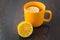 Cup of tea with lemon on table close-up. healthcare, traditional medicine and flu concept - tea cup with lemon.