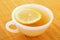 Cup of tea with lemon in warm golden light