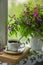 A cup of tea with an old book and a bouquet of forest flowers on a window sill