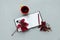 Cup of tea with red leaves of girlish wild grape and open empty note pad on gray wooden background. Top view. Flat lay. Autumn