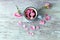 Cup of tea with rose petals, fresh flowers on a wooden surface