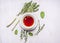 Cup of tea on a saucer with a set of herbal tea thyme, mint, lemon grass on wooden rustic background top view close up