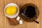 Cup of tea, spoon on saucer, lemon, cinnamon, sugar cubes