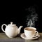 Cup of Tea with Steam and Teapot