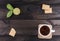 Cup of tea with tea cookies and fresh lime on wooden table