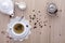 Cup of tea with teapot, milk, sugar, on wooden