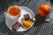 Cup of tea with Wafers in chocolate with biscuits and orange.