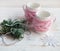 Cup on white wooden table with christmas decorative decor. Winter cozy background