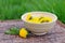 Cup with yellow dandellion in bloom