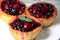 Cupcake basket, with berries on a white plate.