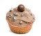 Cupcake with chocolate icing and decoration against white background