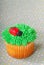 Cupcake decorated with grass frosting