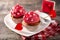 Cupcake decorated with sugar hearts and a cupid arrow for Valentine`s Day