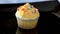 Cupcake with delicate orange cream.