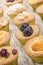 Cupcake with dried fruit on a timber board