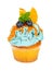 Cupcake with fresh blueberries, mint, slices of orange and syrup