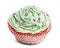 Cupcake with green icing and hundreds and thousands against white background
