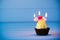 Cupcake with a heart shaped candles for 3 - third birthday