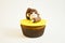 Cupcake with a monkey figure made of fondant