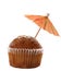 Cupcake muffin with red cocktail parasol