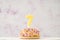 Cupcake with number seven shaped candle for birthday