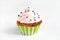 Cupcake with pink cream icing, on white background