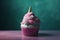 Cupcake with pink and teal colored frosting and unicorn horn. Generative AI