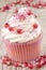 Cupcake with pomegranate and pink sprinkle