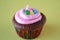 Cupcake with stars and pink frosting