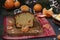 Cupcake with tangerines, covered with chocolate glaze is located on the New Year`s background, Festive still life
