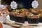 Cupcake varieties with decorative plate with the phrase `Carrot cake with brigadier` on the wooden table