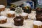 Cupcake varieties with decorative plate with the phrase `Chocolate chip cake` on the wooden table.