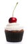 Cupcake with whipped cream and cherry