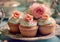 Cupcakes with blue and pink cream and sweet roses on vintage steel tray.Macro.AI Generative