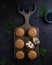 Cupcakes with blueberries on a board with deer horns, top view