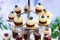 Cupcakes with blueberry on cake stand. Banquet table.