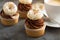 Cupcakes with chocolate frosting and little donuts