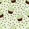 Cupcakes with chocolate sprinkles isolated. Green background. Sweet Dessert with cream. Pistachio or mint taste