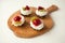 cupcakes with cottage cheese on vintage tray-tasty muffin with strawberry and kiwi on wooden plate